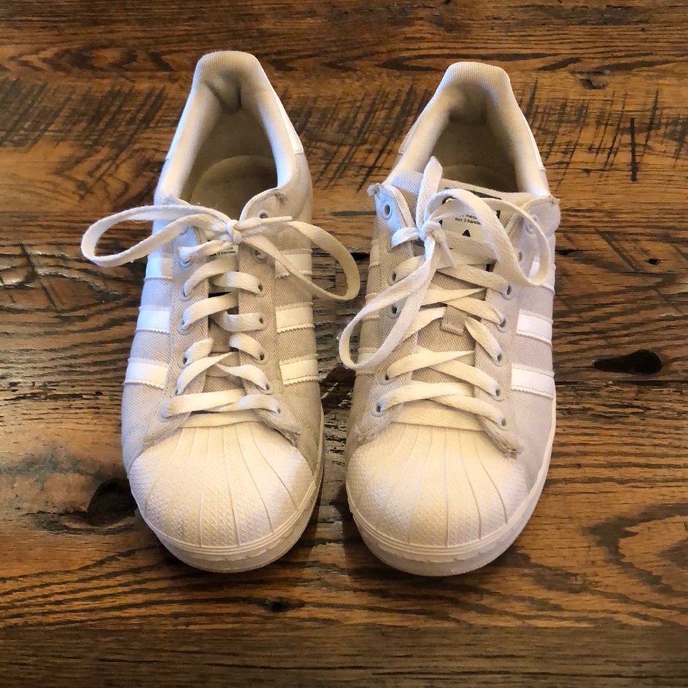 Grey and white women’s Adidas tennis shoes